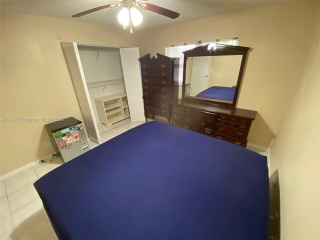 6200 NW 44th St Unit 115, Lauderhill, FL 33319 - unfurnished bedroom featuring tile patterned flooring, ceiling fan, a closet, and baseboards