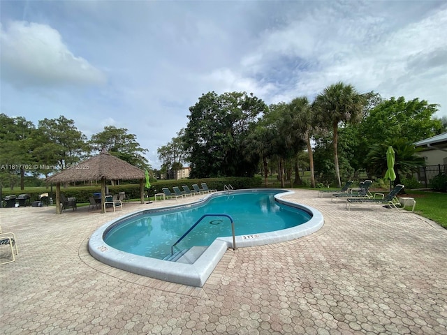 6200 NW 44th St Unit 115, Lauderhill, FL 33319 - community pool featuring a gazebo, a patio area, and view of scattered trees