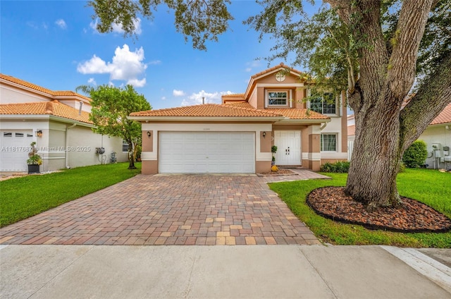 13344 NW 7th St, Plantation, FL 33325 - mediterranean / spanish house featuring decorative driveway, stucco siding, a garage, a tile roof, and a front lawn
