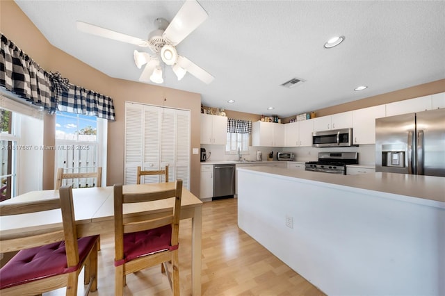 13344 NW 7th St, Plantation, FL 33325 - kitchen featuring stainless steel appliances, healthy amount of natural light, a sink, light countertops, and recessed lighting