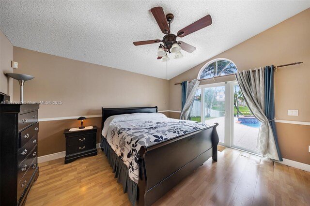 13344 NW 7th St, Plantation, FL 33325 - bedroom featuring access to outside, light wood-style floors, baseboards, a textured ceiling, and lofted ceiling