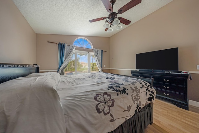 13344 NW 7th St, Plantation, FL 33325 - bedroom with access to exterior, vaulted ceiling, wood finished floors, a textured ceiling, and a ceiling fan