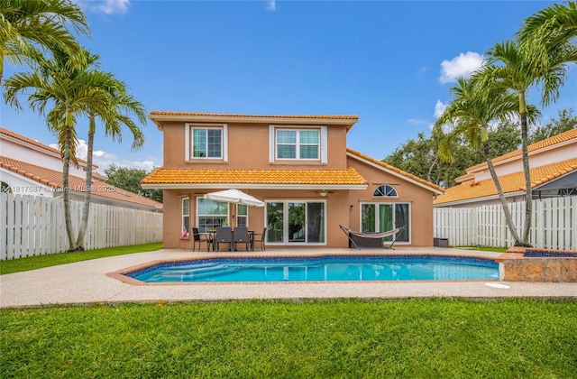 13344 NW 7th St, Plantation, FL 33325 - rear view of property featuring stucco siding, a tile roof, a patio area, and a ceiling fan