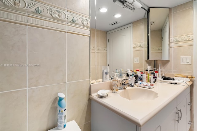 250 174th St Unit 1704, Sunny Isles Beach, FL 33160 - half bathroom with tile walls, vanity, and toilet
