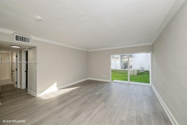 7244 SW 94th Pl Unit C1, Miami, FL 33173 - unfurnished room featuring wood finished floors, baseboards, a textured ceiling, and crown molding