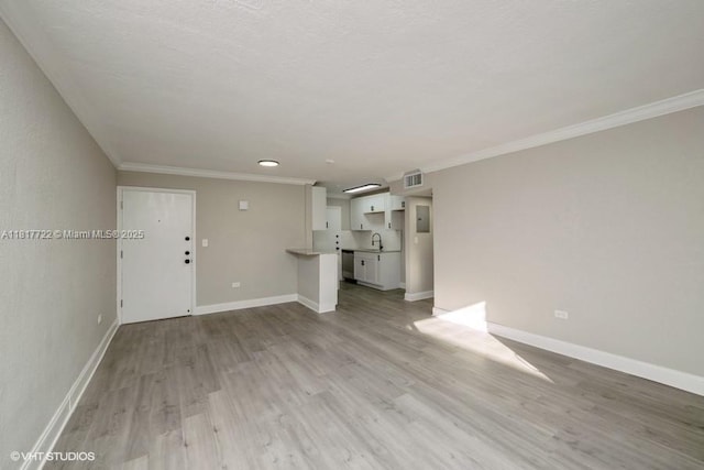 7244 SW 94th Pl Unit C1, Miami, FL 33173 - unfurnished living room featuring a sink, light wood finished floors, ornamental molding, and baseboards