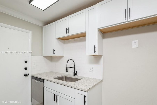 7244 SW 94th Pl Unit C1, Miami, FL 33173 - kitchen with a sink, dishwasher, decorative backsplash, light stone counters, and white cabinets