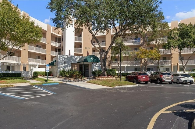 9575 Weldon Cir Unit C413, Tamarac, FL 33321 - view of apartment building / complex with uncovered parking
