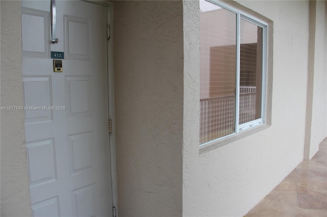 9575 Weldon Cir Unit C413, Tamarac, FL 33321 - doorway to property with stucco siding