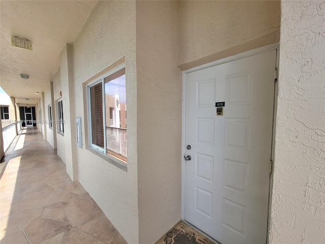 9575 Weldon Cir Unit C413, Tamarac, FL 33321 - view of exterior entry featuring stucco siding