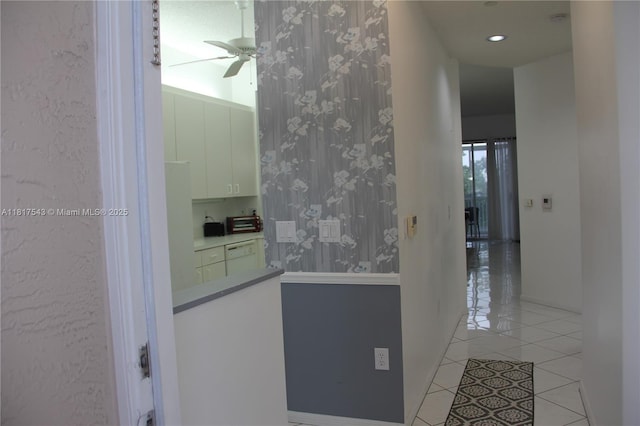 9575 Weldon Cir Unit C413, Tamarac, FL 33321 - hallway featuring wallpapered walls and light tile patterned floors