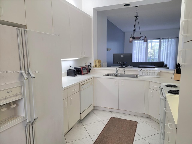 9575 Weldon Cir Unit C413, Tamarac, FL 33321 - kitchen with white appliances, a sink, light countertops, decorative light fixtures, and light marble finish floors