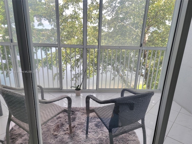 9575 Weldon Cir Unit C413, Tamarac, FL 33321 - sunroom featuring healthy amount of natural light and a water view
