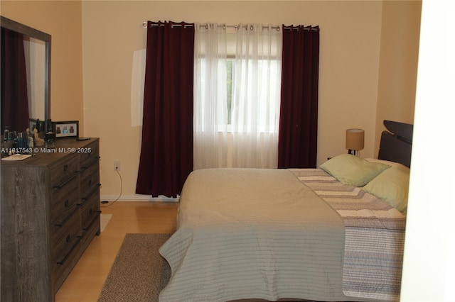 9575 Weldon Cir Unit C413, Tamarac, FL 33321 - bedroom featuring light wood finished floors and baseboards