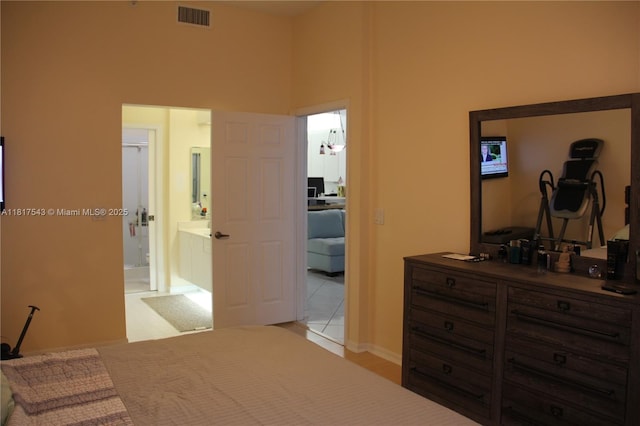 9575 Weldon Cir Unit C413, Tamarac, FL 33321 - bedroom featuring ensuite bathroom and a high ceiling