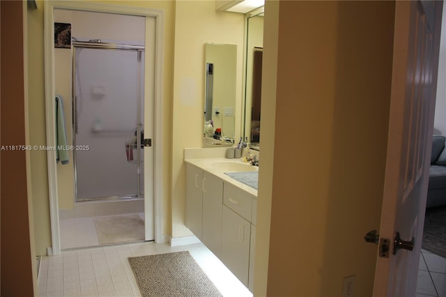 9575 Weldon Cir Unit C413, Tamarac, FL 33321 - full bathroom featuring vanity, a shower stall, and tile patterned floors