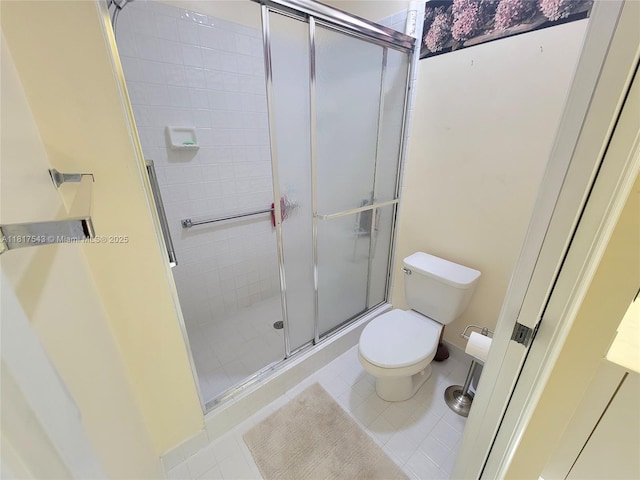 9575 Weldon Cir Unit C413, Tamarac, FL 33321 - full bath featuring toilet, a stall shower, and tile patterned flooring