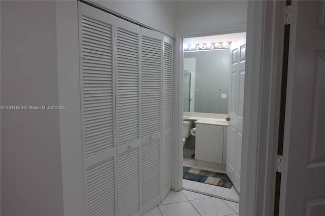 9575 Weldon Cir Unit C413, Tamarac, FL 33321 - bathroom featuring a closet, toilet, vanity, and tile patterned floors