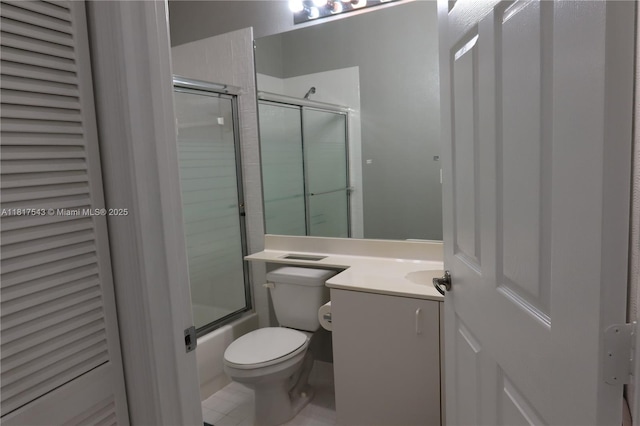 9575 Weldon Cir Unit C413, Tamarac, FL 33321 - full bathroom with toilet, vanity, combined bath / shower with glass door, and tile patterned floors