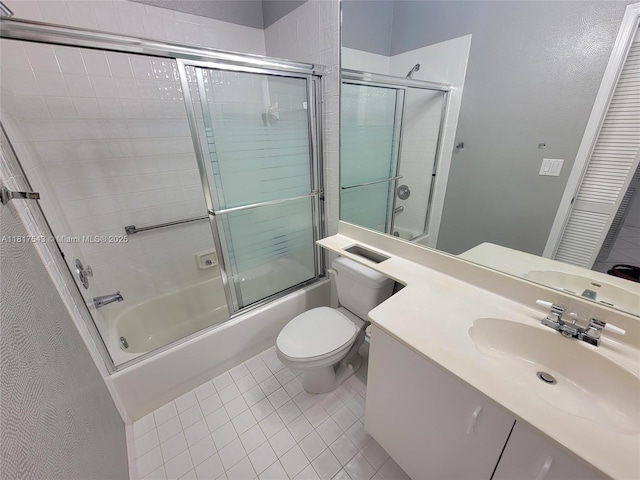 9575 Weldon Cir Unit C413, Tamarac, FL 33321 - bathroom featuring toilet, combined bath / shower with glass door, vanity, and tile patterned floors