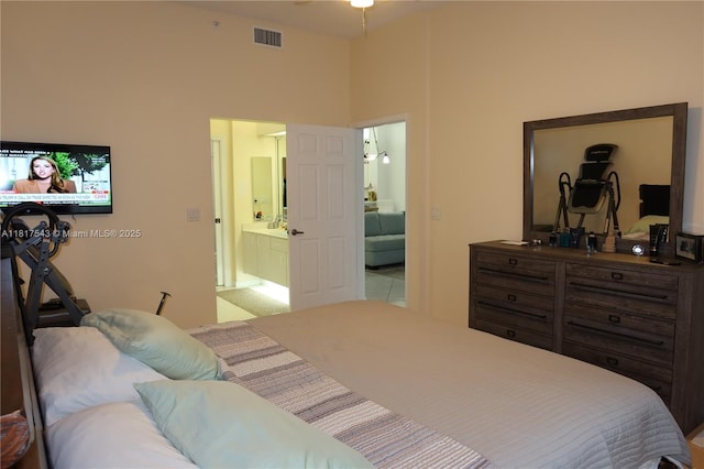9575 Weldon Cir Unit C413, Tamarac, FL 33321 - bedroom featuring a high ceiling and connected bathroom