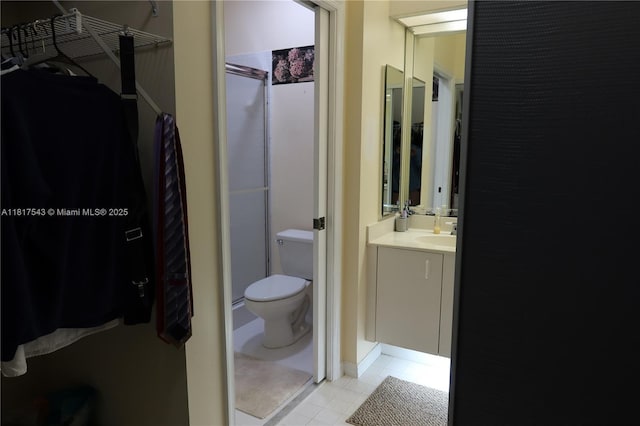 9575 Weldon Cir Unit C413, Tamarac, FL 33321 - bathroom with toilet, tile patterned floors, and vanity