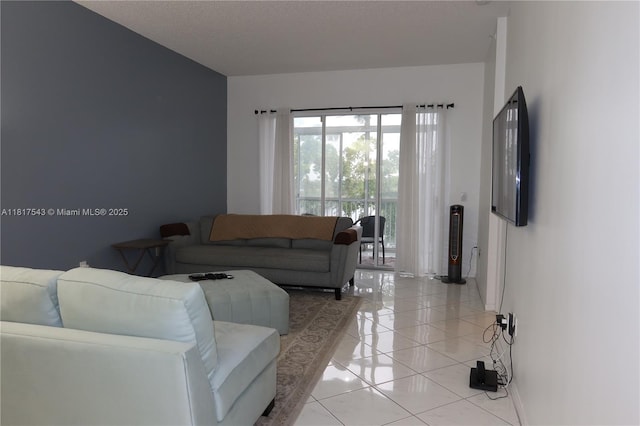 9575 Weldon Cir Unit C413, Tamarac, FL 33321 - living area featuring light tile patterned floors and baseboards