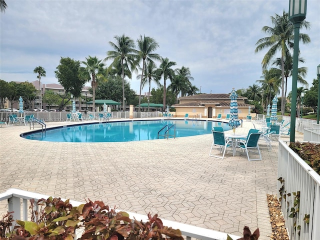 9575 Weldon Cir Unit C413, Tamarac, FL 33321 - community pool featuring a patio area