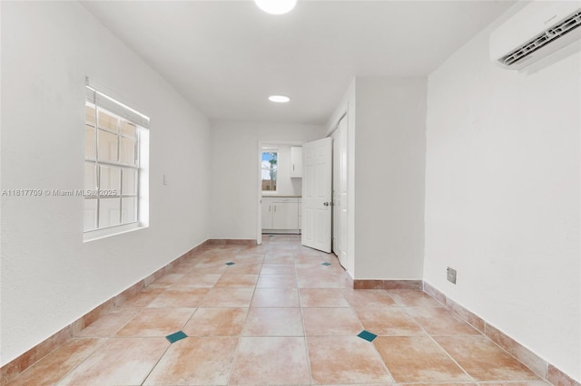 2385 SW 17th St, Miami, FL 33145 - unfurnished room with a wall mounted AC, light tile patterned floors, baseboards, and recessed lighting