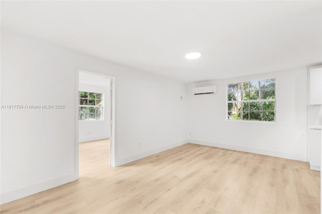 2385 SW 17th St, Miami, FL 33145 - empty room with a wall mounted AC, light wood-type flooring, baseboards, and recessed lighting