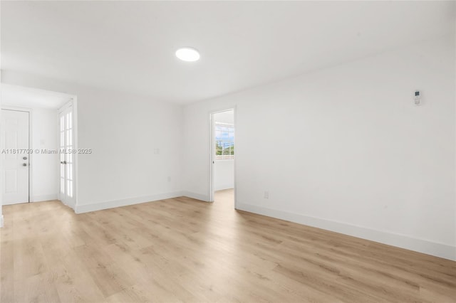 2385 SW 17th St, Miami, FL 33145 - empty room featuring light wood-style floors and baseboards