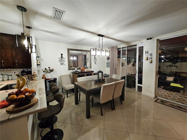 10270 NW 46th St, Doral, FL 33178 - dining area featuring light tile patterned floors