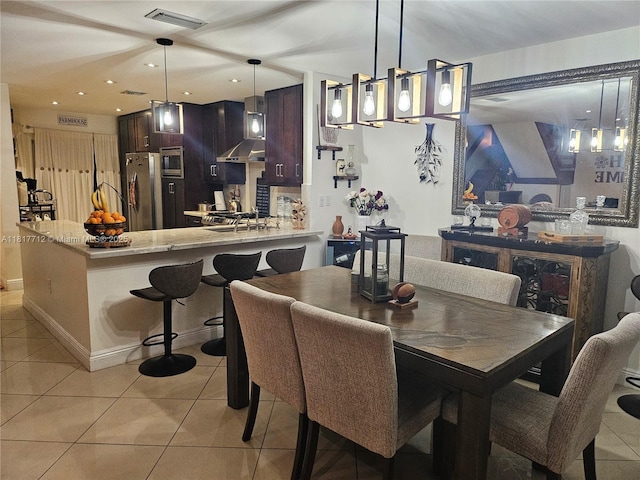 10270 NW 46th St, Doral, FL 33178 - dining area featuring light tile patterned floors, recessed lighting, and baseboards