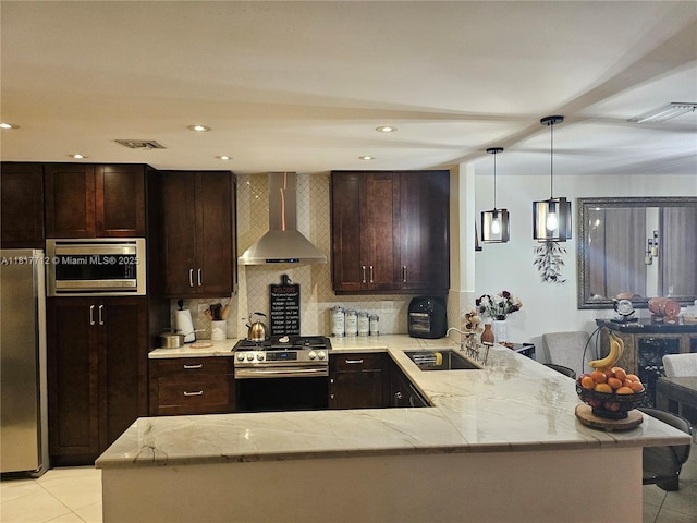 10270 NW 46th St, Doral, FL 33178 - kitchen with wall chimney exhaust hood, stainless steel appliances, a sink, a peninsula, and light tile patterned floors