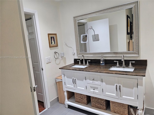 10270 NW 46th St, Doral, FL 33178 - full bathroom with double vanity and baseboards