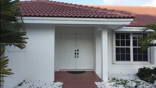1550 SW 52nd Ter, Plantation, FL 33317 - property entrance featuring stucco siding and a tiled roof