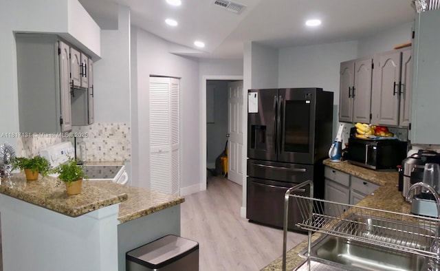 1550 SW 52nd Ter, Plantation, FL 33317 - kitchen with refrigerator with ice dispenser, gray cabinets, black microwave, and recessed lighting