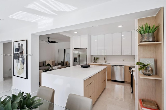 326 SW 20th Rd, Miami, FL 33129 - kitchen featuring appliances with stainless steel finishes, modern cabinets, light countertops, and recessed lighting