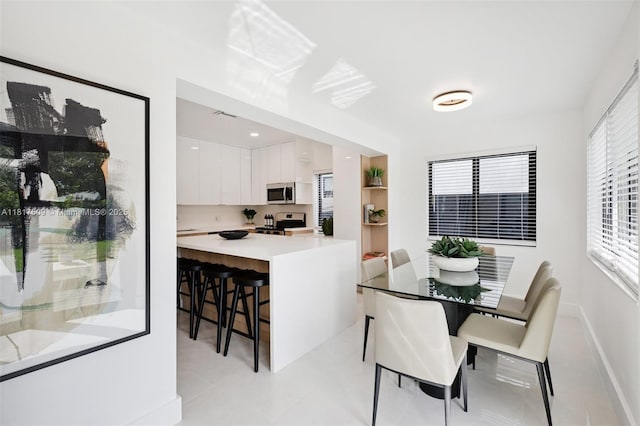 326 SW 20th Rd, Miami, FL 33129 - dining area featuring baseboards