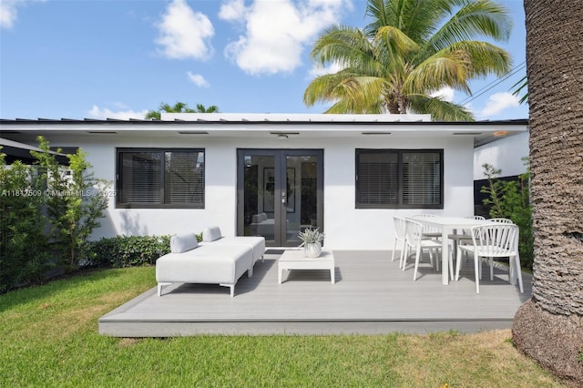 326 SW 20th Rd, Miami, FL 33129 - rear view of property featuring french doors, a deck, stucco siding, and a yard