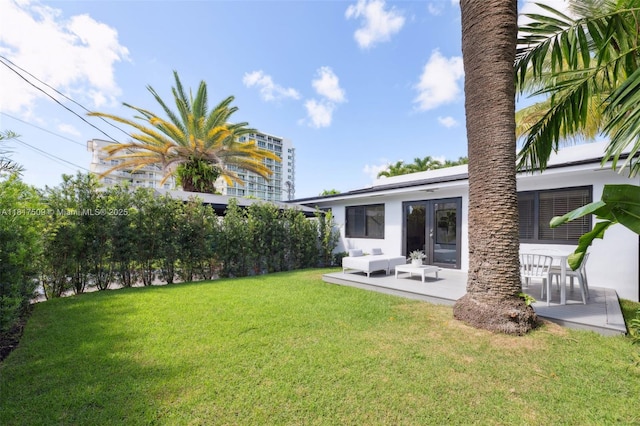 326 SW 20th Rd, Miami, FL 33129 - view of green lawn featuring an outdoor hangout area and a patio