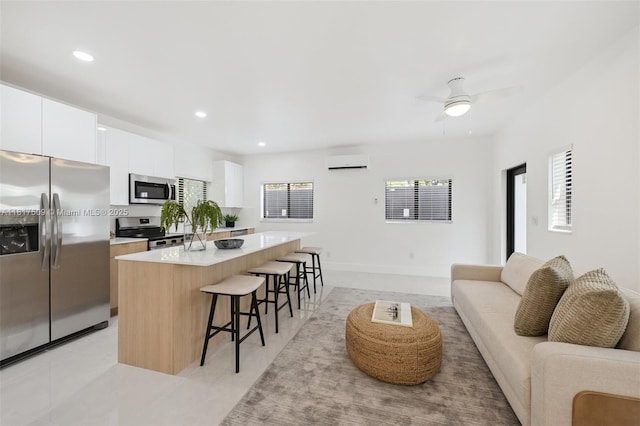 326 SW 20th Rd, Miami, FL 33129 - living area with an AC wall unit, recessed lighting, ceiling fan, and light tile patterned floors