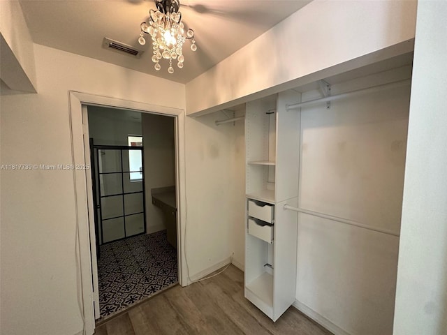 17253 NW 6th Ct, Pembroke Pines, FL 33029 - walk in closet with light wood-style flooring and a chandelier