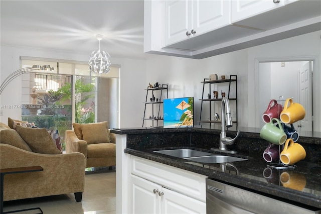 17125 N Bay Rd Unit 3104, Sunny Isles Beach, FL 33160 - kitchen featuring a sink, dishwasher, dark stone countertops, white cabinetry, and light tile patterned floors