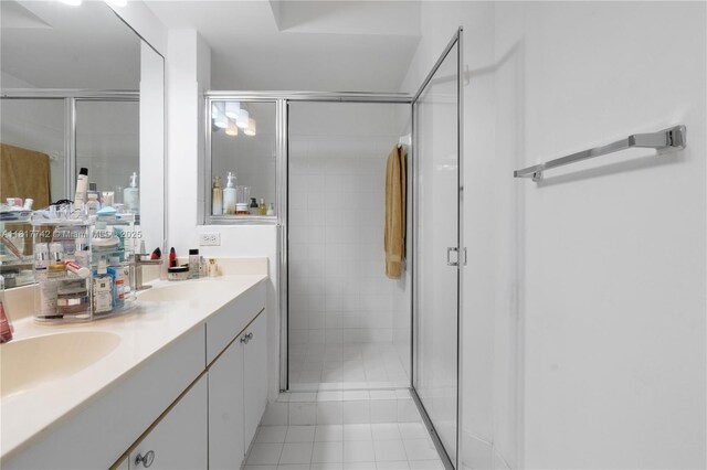 17125 N Bay Rd Unit 3104, Sunny Isles Beach, FL 33160 - full bathroom featuring a shower stall, double vanity, and tile patterned floors