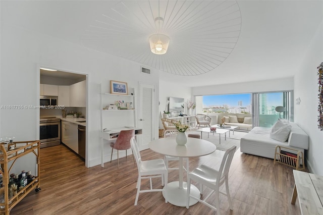 3 Island Ave Unit 12J, Miami Beach, FL 33139 - dining space with wood finished floors