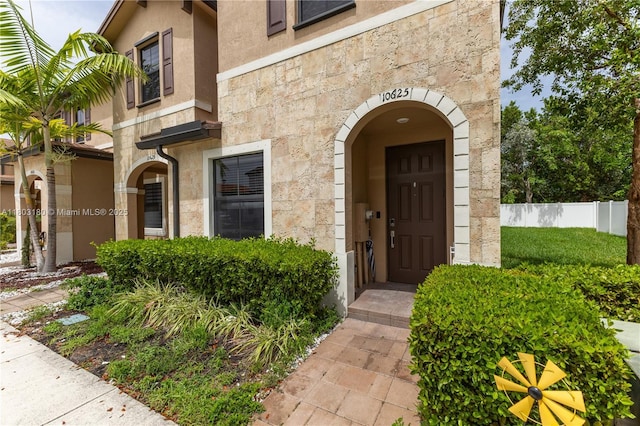 10625 W 32nd Ln, Hialeah, FL 33018 - view of exterior entry with stone siding and stucco siding