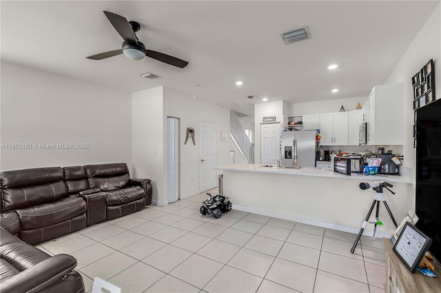 10625 W 32nd Ln, Hialeah, FL 33018 - living area with ceiling fan, recessed lighting, and light tile patterned floors