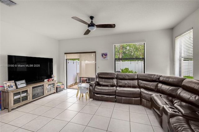 10625 W 32nd Ln, Hialeah, FL 33018 - living area with ceiling fan and light tile patterned floors