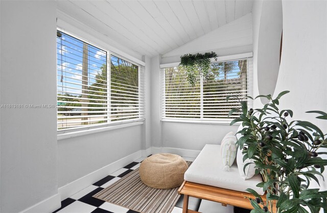 1636 Arthur St, Hollywood, FL 33020 - living area with plenty of natural light, lofted ceiling, tile patterned floors, and baseboards